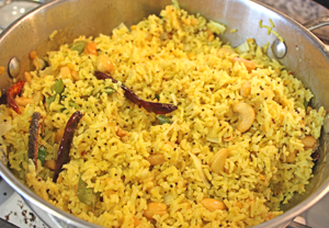  The ingredients are now added to the cooked rice and mixed well